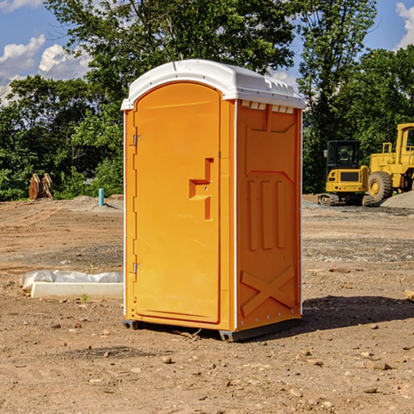 what is the cost difference between standard and deluxe portable restroom rentals in Tuttle